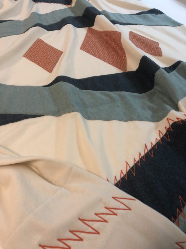 Kearsley custom appliqué cashmere on cashmere contemporary "trade blanket" with embroidery. Base fabric Kearsley st anton cashmere and the appliquécashmeres were cources to fit the design and quality.