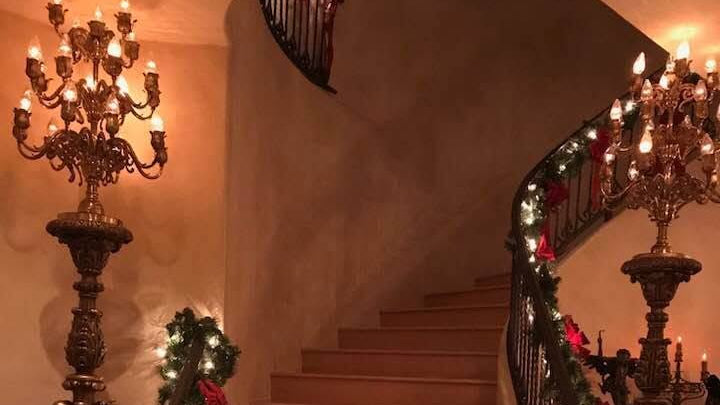 Image of a decorated staircase at Deborah NelsonEmery's home host to he Kearsley 2026 Holiday Trunk Show & Sale in Sonoma, CA