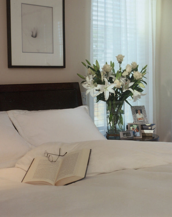 A lovely white and dark wood Kearsely Napa Valley Interior for a 3000SF semi custom home for lovely people.  All white bedding on a walnut bed, with soft sheet curtains and light taupe walls, the perfect retreat after a long day of golf.