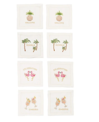 Set of eight white Kim Seybert Mingle cocktail napkins with colorful hand-embroidered celebratory phrases.