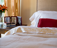 Charles II Bed Cover shown with french seams (not like the one for sale) on a bed with Kearsley Essentials White Sateen Pillowcases with Blonde Tyrolean II Embroidery in a 38 Spatial interior.  Photo by Tara Arrowood.